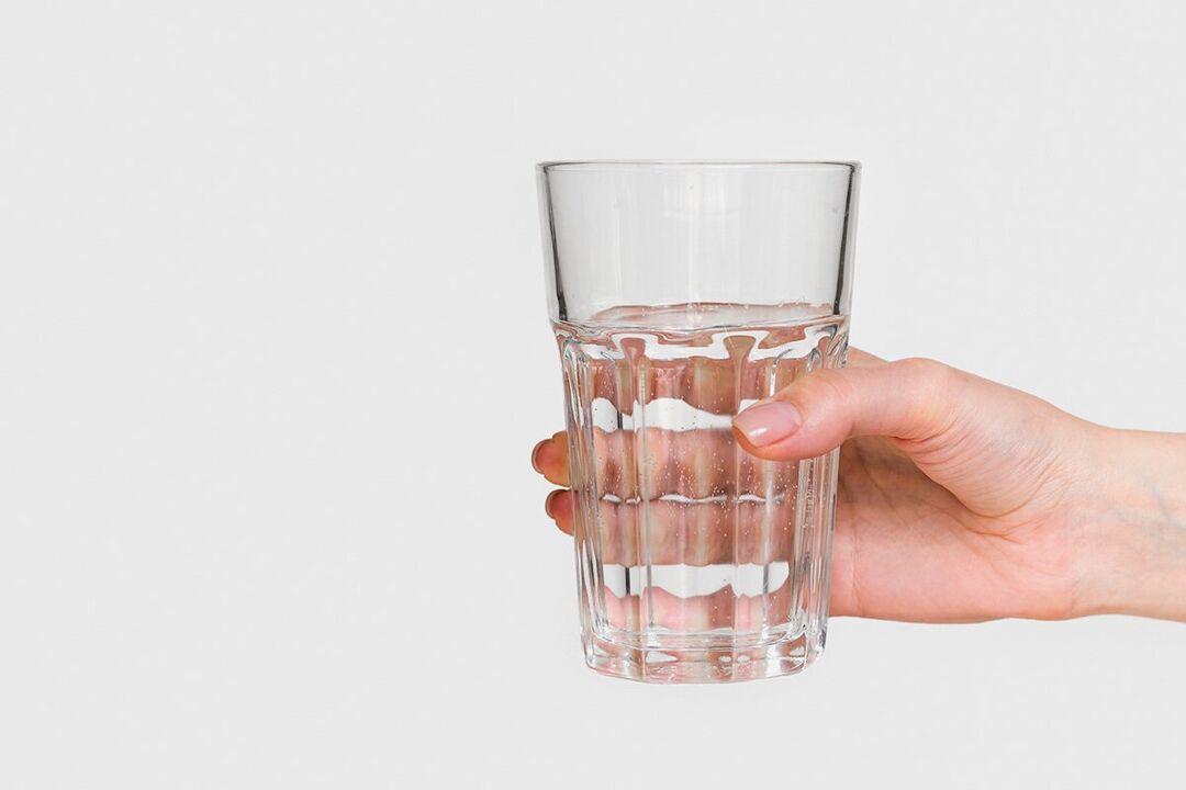 A glass of water with diluted powder zxcvbnmqwert